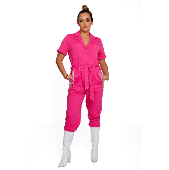 Denim hot pink jumpsuit with rhinestone details on the front pockets ...